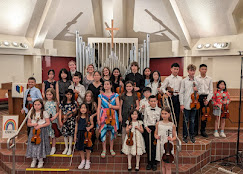 Group photo of Mira's violin students